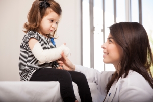 Healthcare professional examining a child